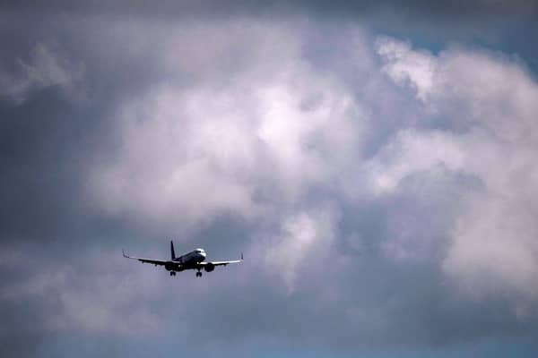 A jet comes in to land at Gatwick Airport. (Photo by Ben Stansall / AFP via Getty Images)