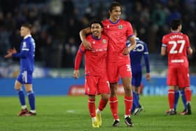 Blackburn Rovers' English midfielder Tyrhys Dolan (C) and Blackburn Rovers' English defender Ashley Phillips (Photo by DARREN STAPLES/AFP via Getty Images)