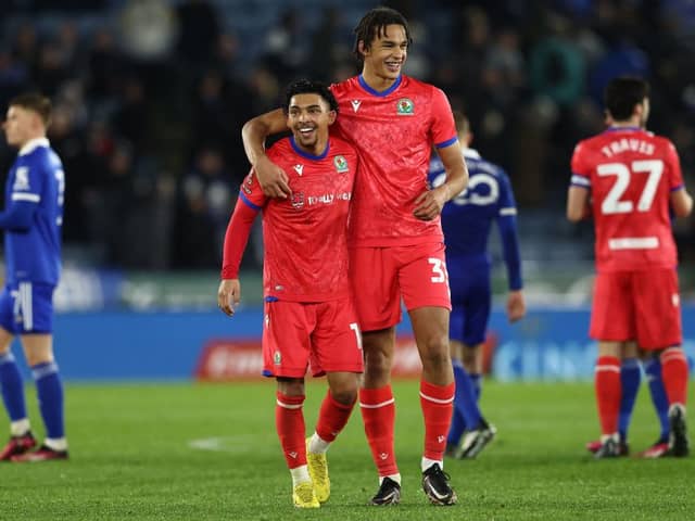 Blackburn Rovers' English midfielder Tyrhys Dolan (C) and Blackburn Rovers' English defender Ashley Phillips (Photo by DARREN STAPLES/AFP via Getty Images)