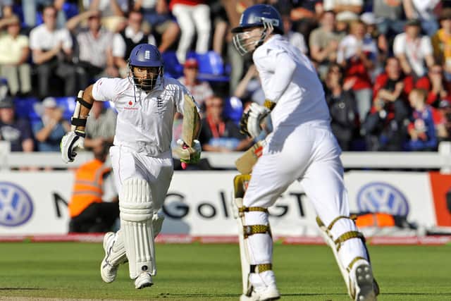 England batsmen Monty Panesar (L) and James Anderson (R) take runs from the Australia bowling as England salvages a draw on the final day of the first Ashes Test match in Cardiff, Wales, on July 12, 2009. AFP PHOTO/William WEST (Photo credit should read WILLIAM WEST/AFP via Getty Images)
