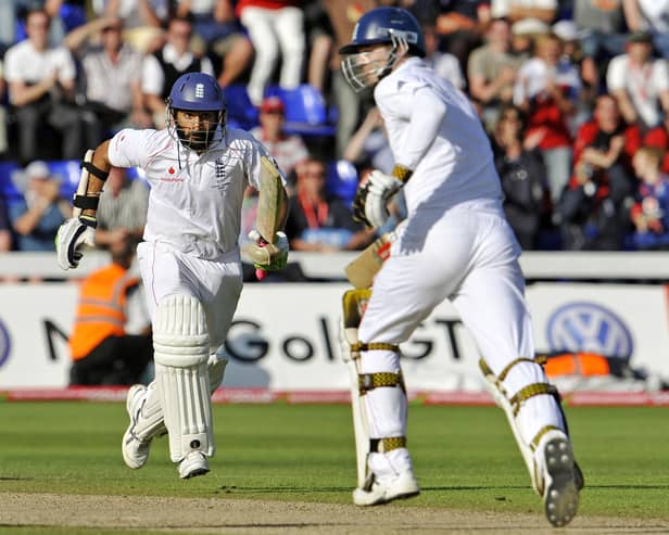 England batsmen Monty Panesar (L) and James Anderson (R) take runs from the Australia bowling as England salvages a draw on the final day of the first Ashes Test match in Cardiff, Wales, on July 12, 2009. AFP PHOTO/William WEST (Photo credit should read WILLIAM WEST/AFP via Getty Images)