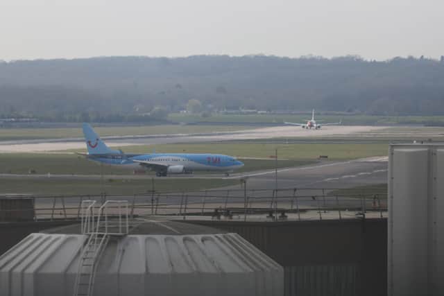 A TUI Airways plane on the tarmac at Gatwick Airport. Credit: Hollie Adams/Getty Images.