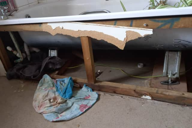 A broken bath tub in Lorna Martin’s home. Credit: Inked PR.