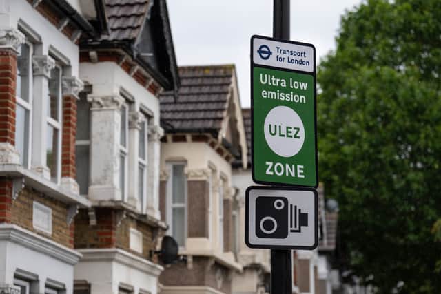 An Ultra Low Emission Zone (ULEZ) sign is displayed at the entrance to the zone. Credit: Carl Court/Getty Images.
