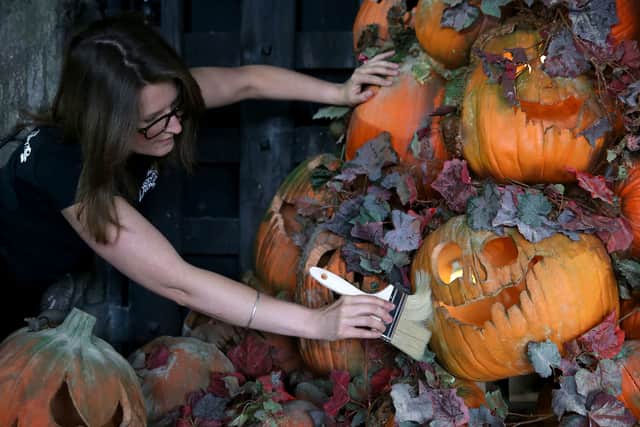 A London Dungeon employee puts the finishing touches to the Halloween installation in 2014. (Photo by Danny E. Martindale/Getty Images)