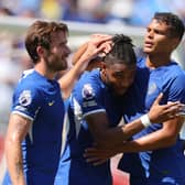 Christopher Nkunku of Chelsea celebrates with teammates Ben Chilwell (L) and Thiago Silva (R)  (Photo by Mike Stobe/Getty Images)