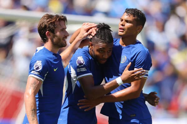 Christopher Nkunku of Chelsea celebrates with teammates Ben Chilwell (L) and Thiago Silva (R)  (Photo by Mike Stobe/Getty Images)