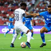  Yves Bissouma #38 of Tottenham Hotspur controls the ball against Pedro Henrique #2 of the Lion City  (Photo by Yong Teck Lim/Getty Images)