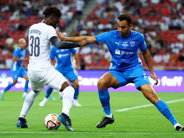  Yves Bissouma #38 of Tottenham Hotspur controls the ball against Pedro Henrique #2 of the Lion City  (Photo by Yong Teck Lim/Getty Images)