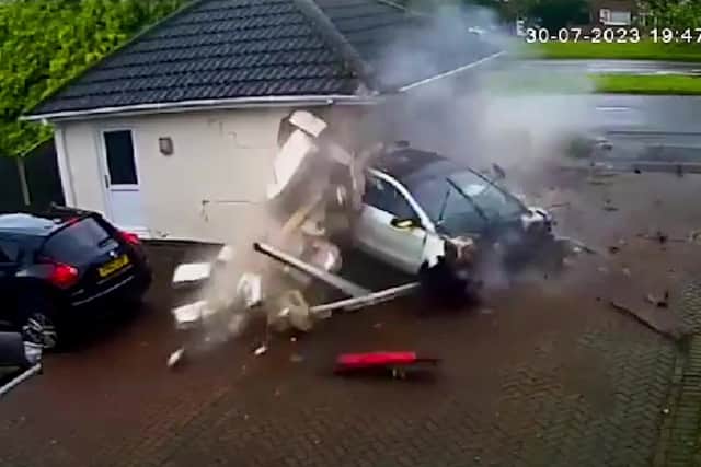 The moment a Mercedes-Benz smashed into a garage in Littleover, Derby. (Photo by Sukie Singh / SWNS)