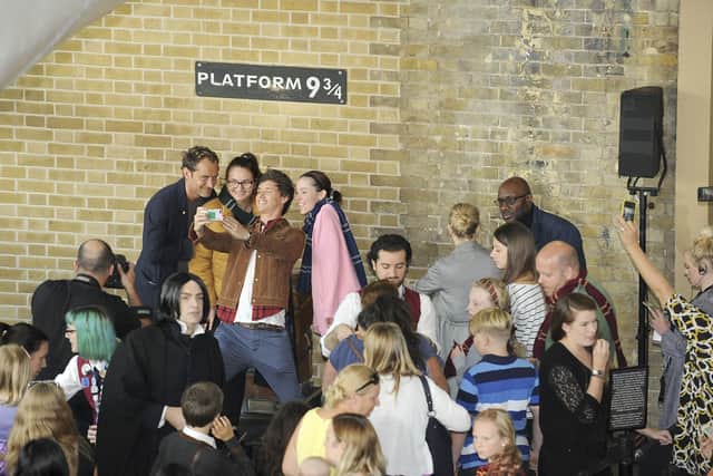Eddie Redmayne and Jude Law, stars of Fantastic Beasts: The Crimes Of Grindelwald, surprise fans at platform 9 3/4 during the Back to Hogwarts day celebration at King’s Cross station on September 1, 2018.  (Photo by Nicky J Sims/Getty Images for Warner Bros)