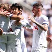 Harry Kane (L) of Tottenham Hotspur celebrates with team mates after scoring the team first goal  (Photo by Charlie Crowhurst/Getty Images)