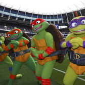 The Teenage Mutant Ninja Turtles on the pitch at Tottenham Hotspur. (Image: Photo by Simon Dael/Tottenham Hotspur FC/Shutterstock)
