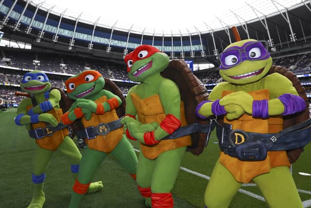 The Teenage Mutant Ninja Turtles on the pitch at Tottenham Hotspur. (Image: Photo by Simon Dael/Tottenham Hotspur FC/Shutterstock)