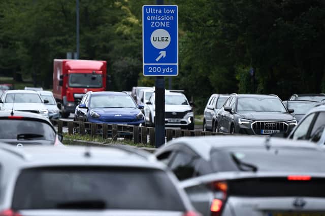 Londoners trading-in their non-compliant cars can receive a £2,000 grant payment from TfL, plus a potential additional payment from the company scrapping the vehicle. Credit: Justin Tallis/AFP via Getty Images.