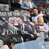 Fans hold a protest banner calling for Tottenham Hotspur's English chairman Daniel Levy to leave the club   (Photo by GLYN KIRK/AFP via Getty Images)