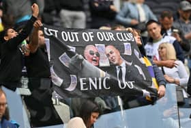 Fans hold a protest banner calling for Tottenham Hotspur's English chairman Daniel Levy to leave the club   (Photo by GLYN KIRK/AFP via Getty Images)