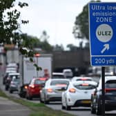 Traffic passes a ULEZ sign near Hanger Lane in west London. (Photo by JUSTIN TALLIS/AFP via Getty Images)
