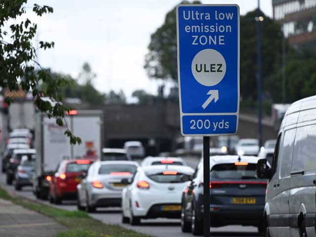 Traffic passes a ULEZ sign near Hanger Lane in west London. (Photo by JUSTIN TALLIS/AFP via Getty Images)