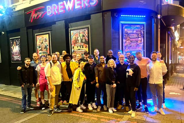 Supporters gather outside the Two Brewers in Clapham following homophobic stabbing