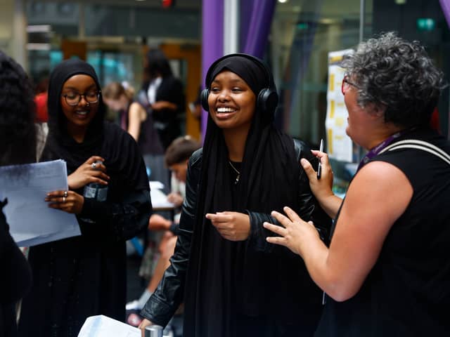 Student Rayaan Mahamoud celebrates her A Level results with a member of teaching staff at City of London Academy. (Photo by Peter Nicholls/Getty Images)