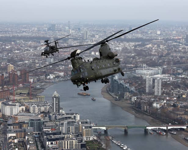 Stock image of a Royal Air Force Chinook helicopter over London. (Photo by CARL COURT/AFP via Getty Images)
