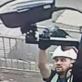 The police has released an image of a man wanted in connection with four offences related to the damage of ULEZ cameras. Credit: Met Police.