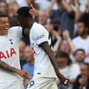 Tottenham Hotspur's Spanish defender #23 Pedro Porro congratulates Tottenham Hotspur's Senegalese midfielder #29 Pape Matar Sarr   (Photo by ADRIAN DENNIS/AFP via Getty Images)