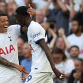 Tottenham Hotspur's Spanish defender #23 Pedro Porro congratulates Tottenham Hotspur's Senegalese midfielder #29 Pape Matar Sarr   (Photo by ADRIAN DENNIS/AFP via Getty Images)