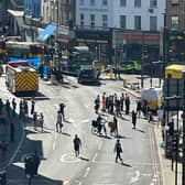 A large cordon is in place on Peckham High Street after a pedestrian died in a collision with a lorry. Credit: LondonWorld.