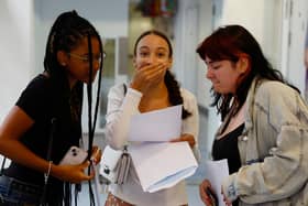 Nada Tazouti (centre) celebrates her GCSE results at the City of London Academy. (Photo by Peter Nicholls/Getty Images)
