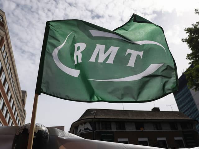 A RMT flag flies at a picket line outside Euston Station. Credit: Hollie Adams/Getty Images.