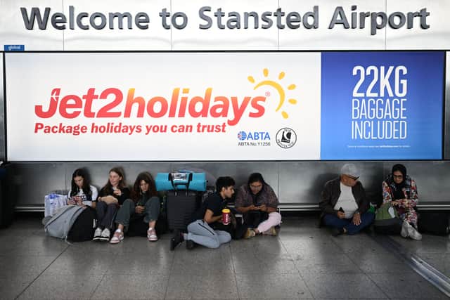 Passengers waiting at Stansted Airport. Credit: Daniel Leal/AFP via Getty Images.