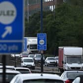 Traffic passes a sign indicating the ULEZ near Hanger Lane in west London. Credit: Justin Tallis/AFP via Getty Images.