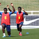  Marc Guehi and Bukayo Saka of England stretch during a training session at St Georges Park (Photo by Catherine Ivill/Getty Images)
