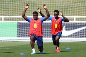  Marc Guehi and Bukayo Saka of England stretch during a training session at St Georges Park (Photo by Catherine Ivill/Getty Images)