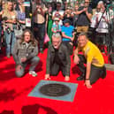 Billy Bragg’s stone on Camden Town’s Music Walk of Fame. The singer is pictured at the unveiling with Jamie Webster and Chris Packham. (Photo by André Langlois)