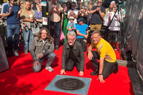 Billy Bragg’s stone on Camden Town’s Music Walk of Fame. The singer is pictured at the unveiling with Jamie Webster and Chris Packham. (Photo by André Langlois)