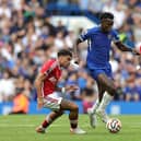 Nicolas Jackson of Chelsea moves away from Morgan Gibbs-White during the Premier League match  (Photo by David Rogers/Getty Images)