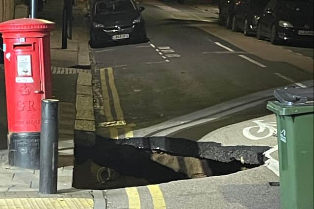 Residents on Dunvegan Road in Eltham, Greenwich, London awoke to discover a sinkhole the size of a small car opened up overnight on September 12.  (Photo by Andrew Hudson/SWNS)
