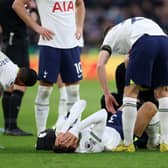Rodrigo Bentancur of Tottenham Hotspur goes down with an injury during the Premier League match between Leicester City (Photo by Catherine Ivill/Getty Images)