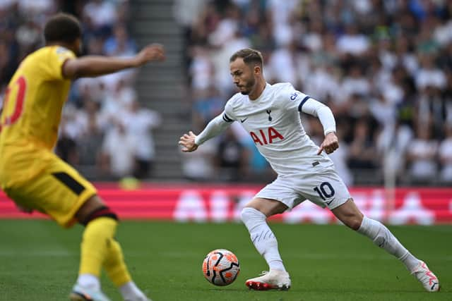 Tottenham Hotspur’s James Maddison runs with the ball against Sheffield United. (Photo by JUSTIN TALLIS / AFP / Getty)