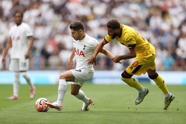 Manor Solomon of Tottenham Hotspur is challenged by Jayden Bogle of Sheffield United. (Photo by Ryan Pierse/Getty Images)