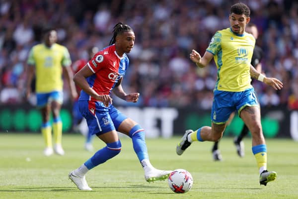  Michael Olise of Crystal Palace holds the ball whilst under pressure from Morgan Gibbs-White . (Photo by Richard Heathcote/Getty Images)