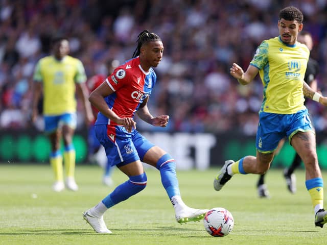  Michael Olise of Crystal Palace holds the ball whilst under pressure from Morgan Gibbs-White . (Photo by Richard Heathcote/Getty Images)