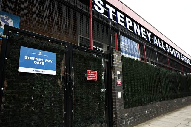 The closed, padlocked gates of Stepney All Saints School in east London on September 19, 2023, following an update to the UK government’s published list of schools affected by the reinforced autoclaved aerated concrete (RAAC) crisis. (Photo by HENRY NICHOLLS/AFP via Getty Images)