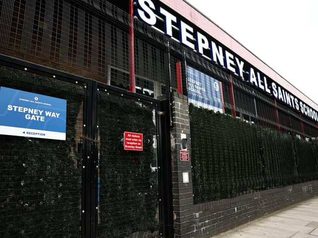 The closed, padlocked gates of Stepney All Saints School in east London on September 19, 2023, following an update to the UK government’s published list of schools affected by the reinforced autoclaved aerated concrete (RAAC) crisis. (Photo by HENRY NICHOLLS/AFP via Getty Images)