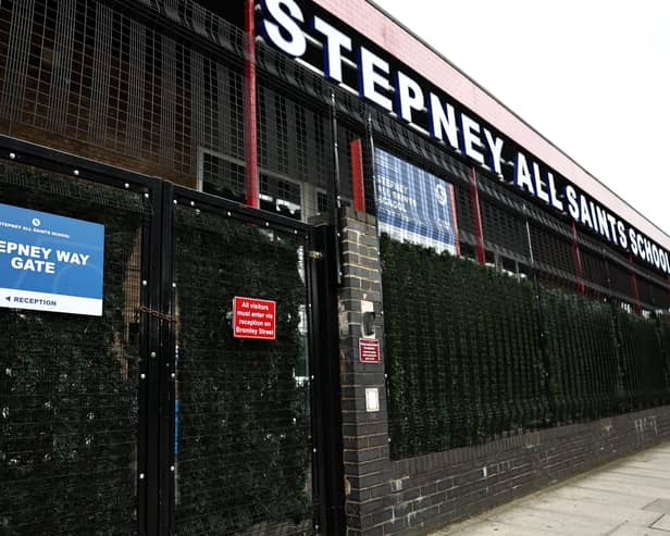 The closed, padlocked gates of Stepney All Saints School in east London on September 19, 2023, following an update to the UK government’s published list of schools affected by the reinforced autoclaved aerated concrete (RAAC) crisis. (Photo by HENRY NICHOLLS/AFP via Getty Images)