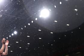 Rain falling at Arsenal’s Emirates Stadium on Wednesday evening. (Photo by Alex Pantling/Getty Images)
