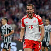  Harry Kane of Bayern Munich celebrates after scoring their sides third goal from the penalty spot during the UEFA Champions League match (Photo by Matthias Hangst/Getty Images) 